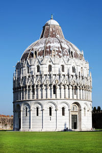 Pisa baptistery against blue sky