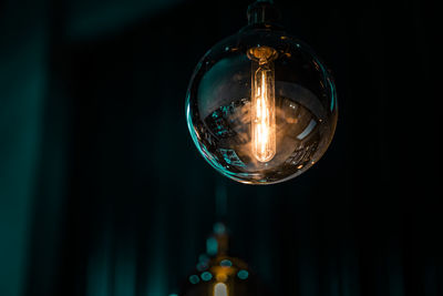 Close-up of illuminated light bulb