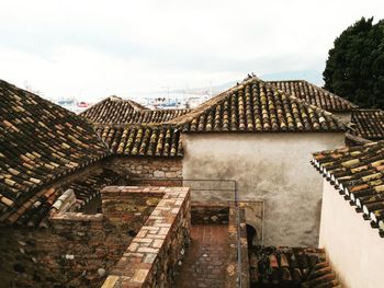 High angle view of roof and building against sky