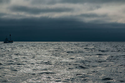 Scenic view of sea against sky at dusk