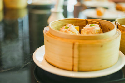 Close-up of dim sum in steamer