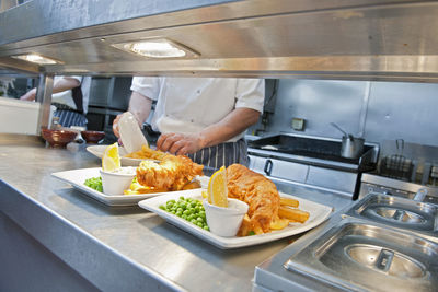 Fish and chips prepared at commercial kitchen in the uk
