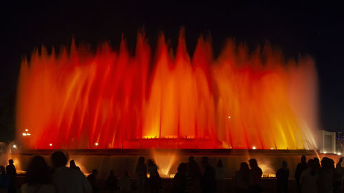 Panoramic view of people at night