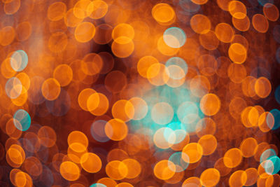 Defocused image of illuminated christmas lights at night