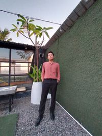 Portrait of young man standing outdoors