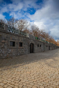 View of old building against cloudy sky