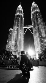 Low angle view of modern office building at night