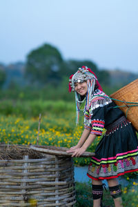 Rear view of woman standing by plants