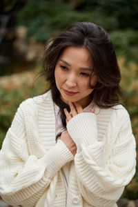 Portrait of smiling young woman standing outdoors