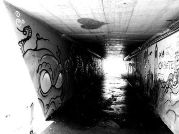 Graffiti on wall in tunnel