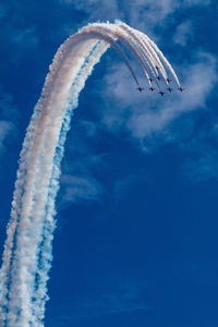 Low angle view of airplane flying in sky