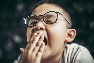 Close-up portrait of boy with eyeglasses