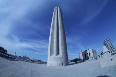 Low angle view of building against cloudy sky