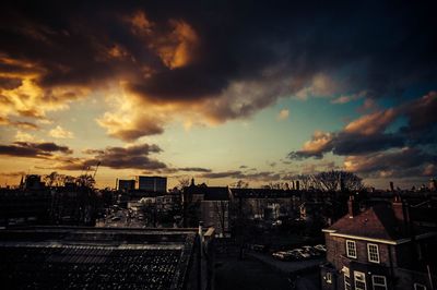 Cityscape against cloudy sky