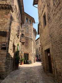 Narrow alley amidst buildings in city