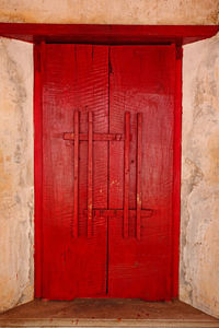 Closed red door of building