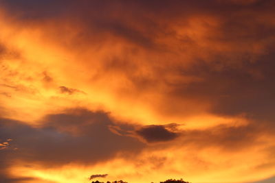 Low angle view of dramatic sky during sunset