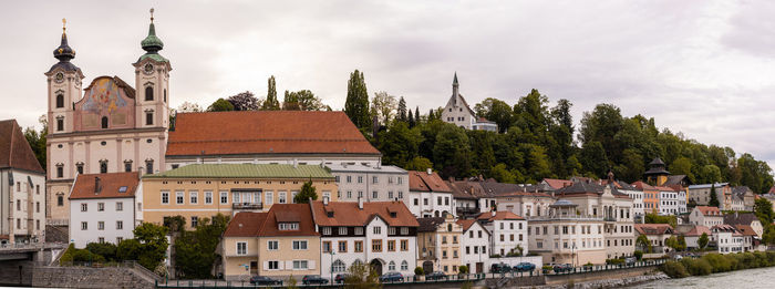 Buildings in city against sky