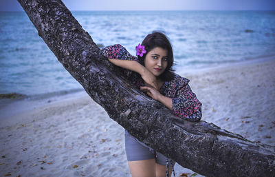 Portrait of beautiful young woman on beach