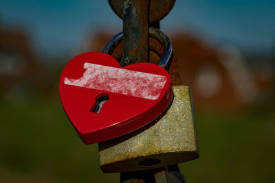 Close-up of padlocks attached to railing