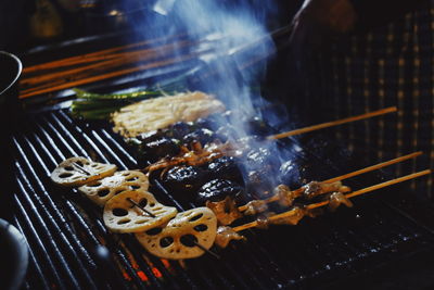 High angle view of meat on barbecue grill