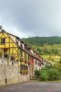 Street with historical half-timbered houses in kaysersberg, alsace, france