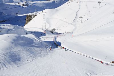 People skiing on snowcapped mountain