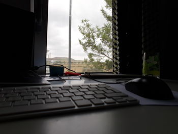 Close-up of laptop on table at home