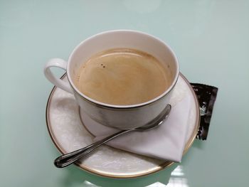High angle view of coffee cup on table