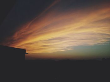 Silhouette of trees against sky at sunset