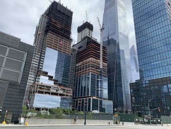 Low angle view of modern buildings against sky in downtown new york city