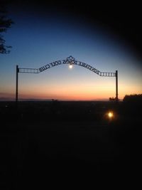 View of illuminated street lights at night