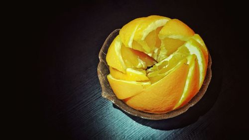 Close-up of yellow fruit against black background