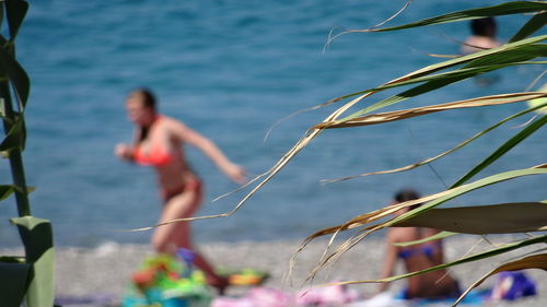 Full length of shirtless man in sea