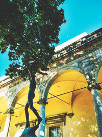 Low angle view of building against clear blue sky
