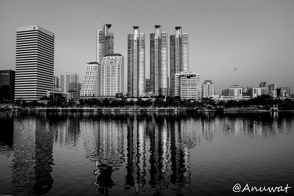 building exterior, architecture, water, built structure, waterfront, city, reflection, skyscraper, river, clear sky, office building, modern, urban skyline, rippled, cityscape, building, tower, tall - high, lake, sky