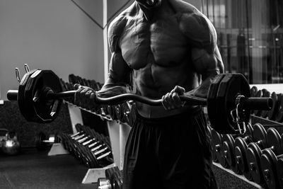 Rear view of man exercising in gym