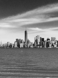 Cityscape by east river against sky