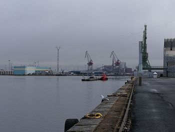 Boats in water against sky
