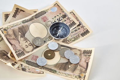 Close-up of currency over white background