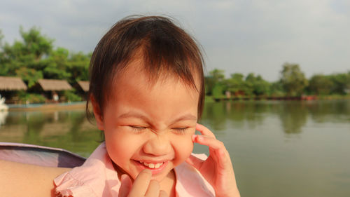 Portrait of a girl with lake