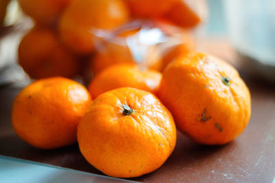 Close-up of orange fruits on table