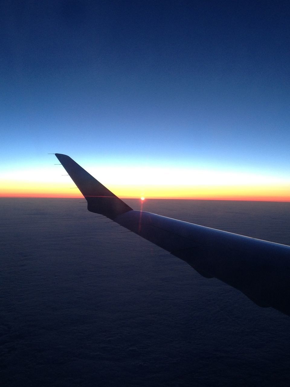 sunset, airplane, sea, transportation, aircraft wing, air vehicle, mode of transport, horizon over water, flying, sky, scenics, beauty in nature, travel, nature, copy space, journey, blue, part of, tranquil scene, water