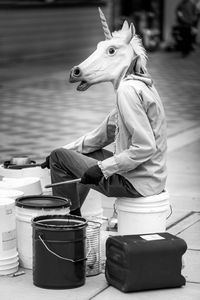 Side view of man sitting in water