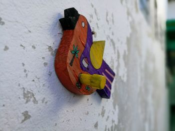 Close-up of a stuffed toy on wall