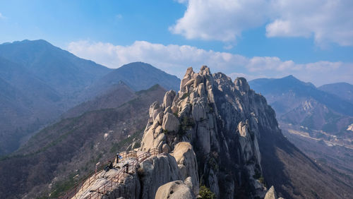 Panoramic view of rocky mountains against sky
