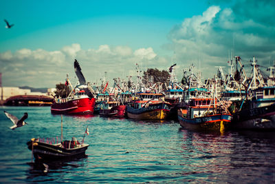 Boats in sea against sky