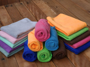 High angle view of colorful towels on wooden floor