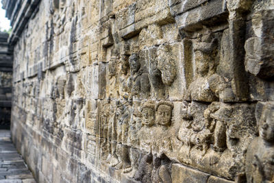 Close-up of sculptures on wall of a temple