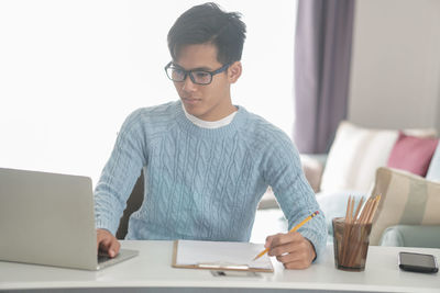 Young man using mobile phone